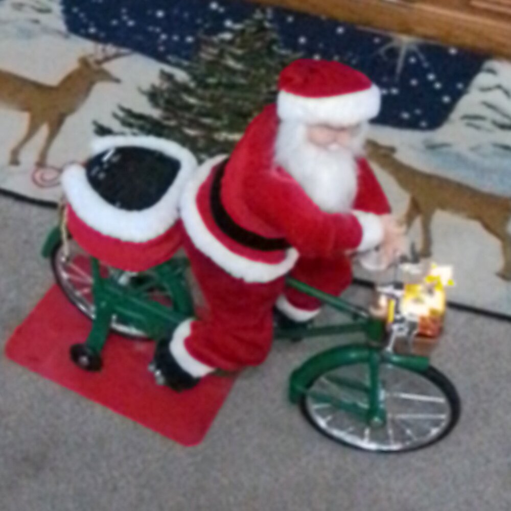 Mr. Christmas Cycling Santa
